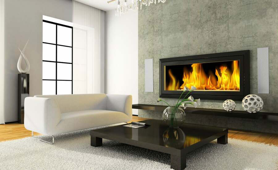 living room with a home audio in wall, there's a tv displaying fire like a fireplace with flush in wall speaker on either side of it