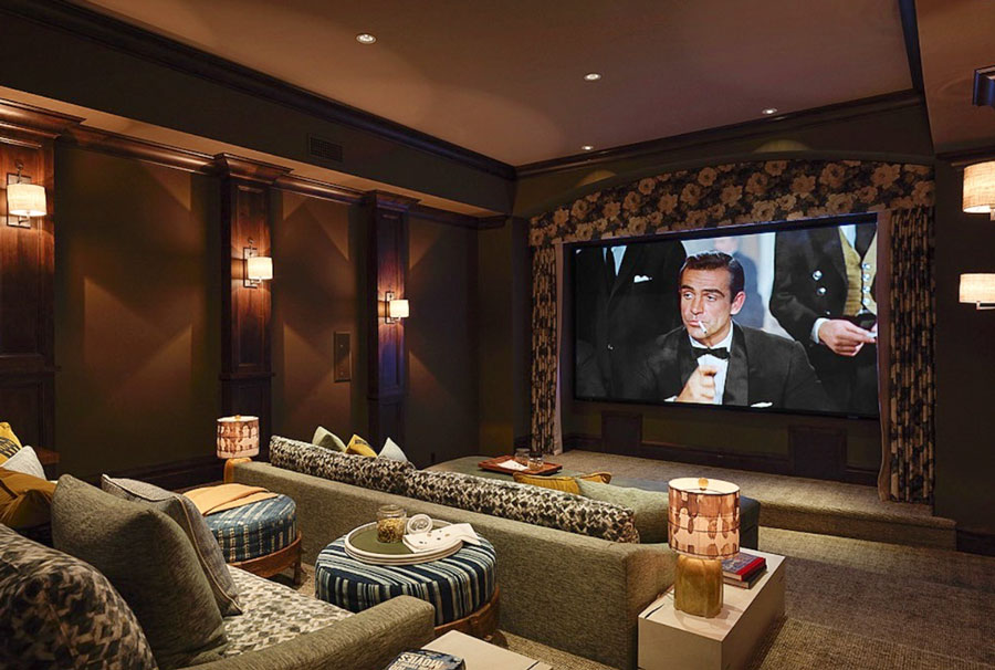 a home with a theater and couches set up like theater seating depciting luxury living 